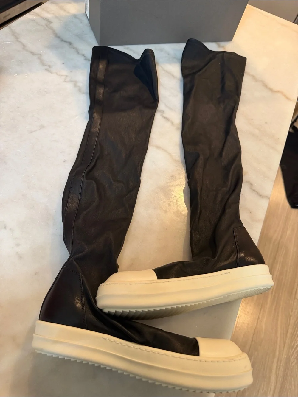 Rick Owens black knee-high boots with white platform sole
